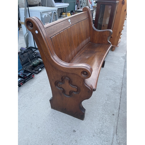 2700 - A VICTORIAN OAK PEW WITH CURVED BACK AND DISHED SEAT, 49.5