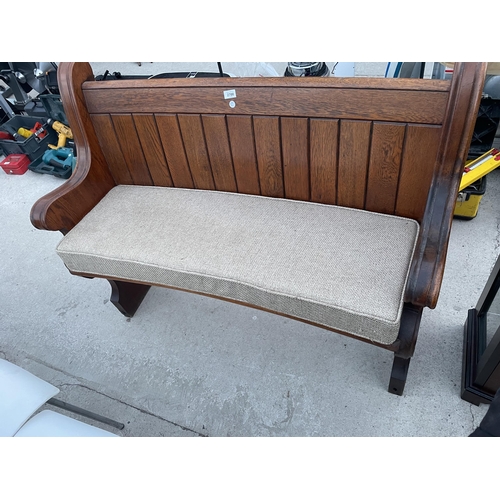 2700 - A VICTORIAN OAK PEW WITH CURVED BACK AND DISHED SEAT, 49.5