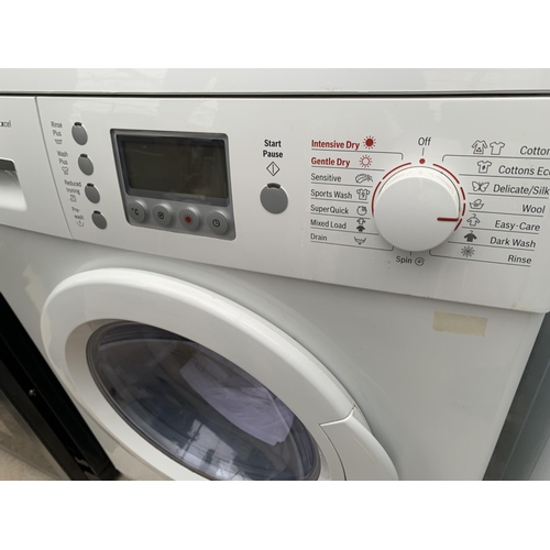 2056 - A WHITE BOSCH EXXCEL WASHER DRYER WITH INSTRUCTION MANUAL