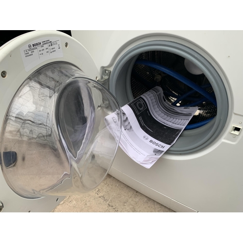 2056 - A WHITE BOSCH EXXCEL WASHER DRYER WITH INSTRUCTION MANUAL