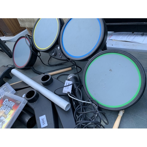 2093 - A PLAYSTATION DRUM KIT AND TWO GAMES TO INCLUDE GUITAR HERO WORLD TOUR