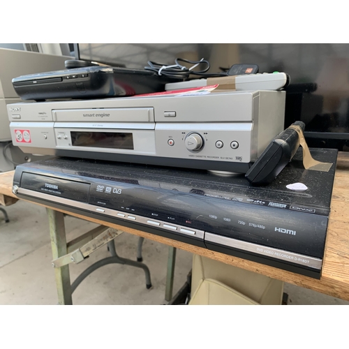 2129A - A TOSHIBA DVD PLAYER, A SONY VHS PLAYER AND A TECHNIKA DVD PLAYER ETC