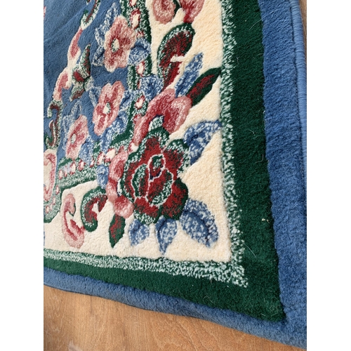 2199 - A LARGE BLUE PATTERNED RUG