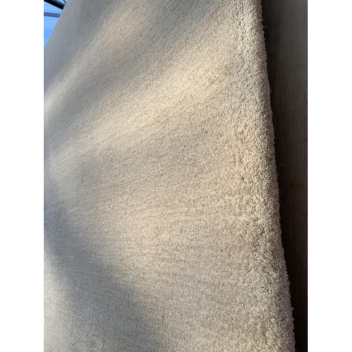 2200 - A LARGE MODERN CREAM RUG