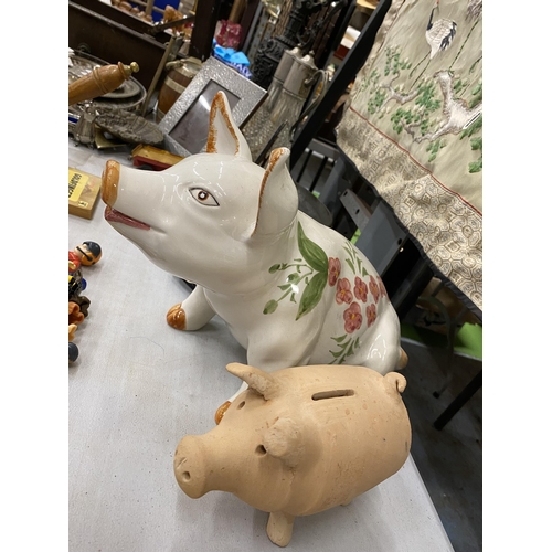 1049 - THREE CERAMIC MONEY BOXES ONE BEING A LARGE PIG