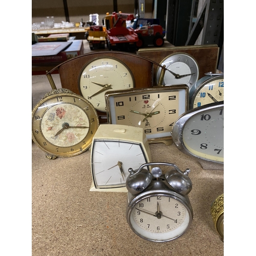 1102 - A LARGE QUANTITY OF VINTAGE MANTLE CLOCKS TO INCLUDE PETIT POINT, SMITHS, ALARM CLOCKS, ETC