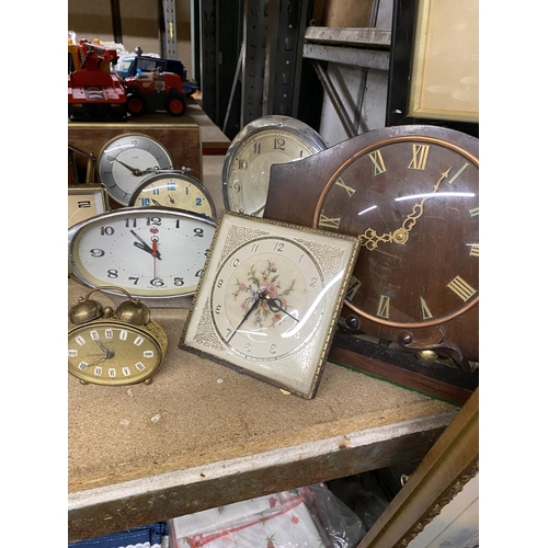 1102 - A LARGE QUANTITY OF VINTAGE MANTLE CLOCKS TO INCLUDE PETIT POINT, SMITHS, ALARM CLOCKS, ETC