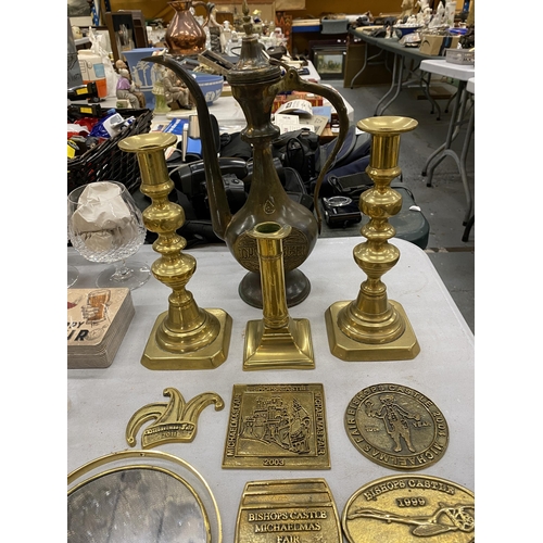 222 - A QUANTITY OF VINTAGE BRASS MICHAELMAS FAIR PLAQUES, CANDLESTICKS AND A MIDDLE EASTERN STYLE COFFEE ... 