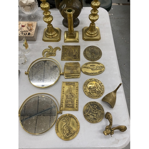 222 - A QUANTITY OF VINTAGE BRASS MICHAELMAS FAIR PLAQUES, CANDLESTICKS AND A MIDDLE EASTERN STYLE COFFEE ... 