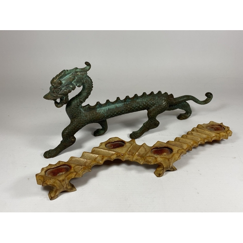 343 - A 19TH CENTURY CHINESE BRONZE MODEL OF A DRAGON ON CARVED WOODEN BASE, LENGTH 30CM