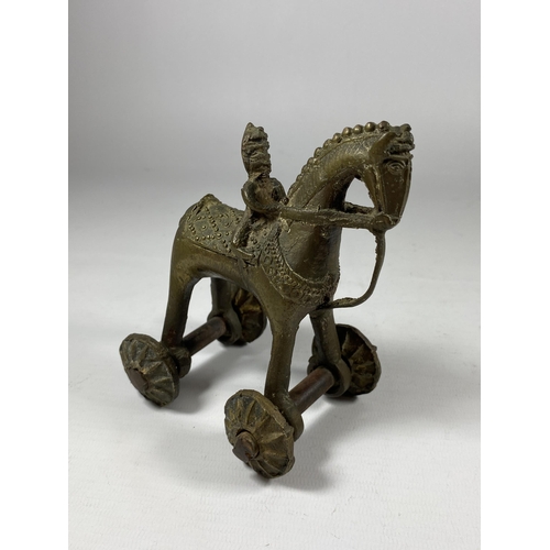 345 - AN UNUSUAL 19TH CENTURY INDIAN METAL TEMPLE TOY MODEL OF A HORSE AND RIDER, HEIGHT 12CM