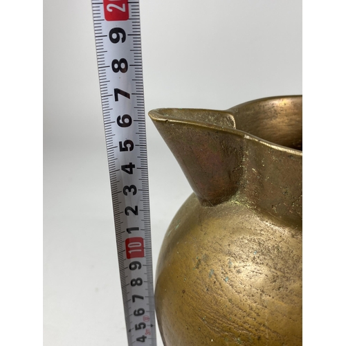 358 - AN UNUSUAL HEAVY BRASS JUG OF SPHERICAL BASE, HEIGHT 16CM