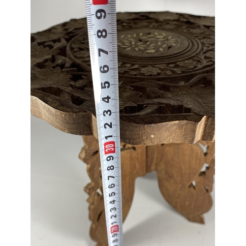 360 - A CAVRED TRIBAL TRIPOD TABLE, HEIGHT 32CM