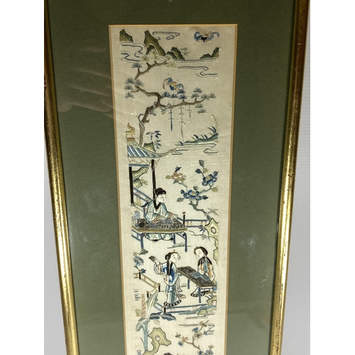 379 - A LARGE GILT FRAMED CHINESE SILK OF A GARDEN SCENE, 64 X 21CM