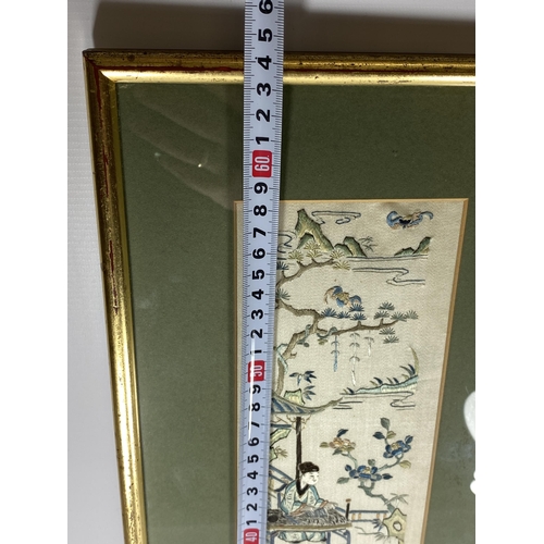 379 - A LARGE GILT FRAMED CHINESE SILK OF A GARDEN SCENE, 64 X 21CM