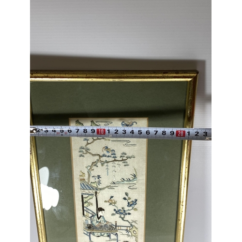 379 - A LARGE GILT FRAMED CHINESE SILK OF A GARDEN SCENE, 64 X 21CM