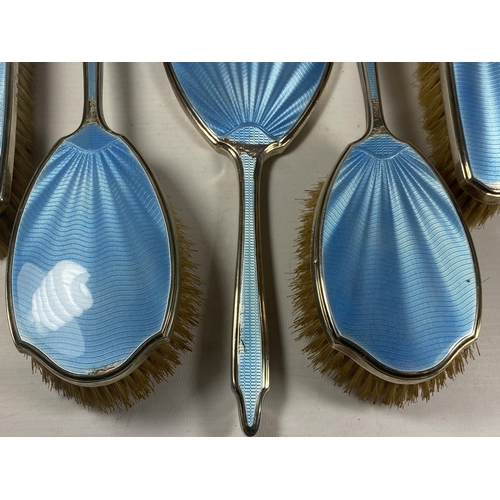 14 - A FIVE PIECE HALLMARKED SILVER BACKED & BLUE GUILLOCHE ENAMEL DRESSING SET COMPRISING TWO HAIR BRUSH... 