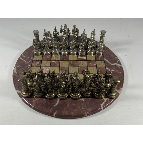 5 - A METAL WARRIOR CHESS SET ON MARBLE BASE, BOARD DIAMETER 26CM