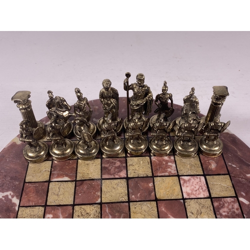 5 - A METAL WARRIOR CHESS SET ON MARBLE BASE, BOARD DIAMETER 26CM
