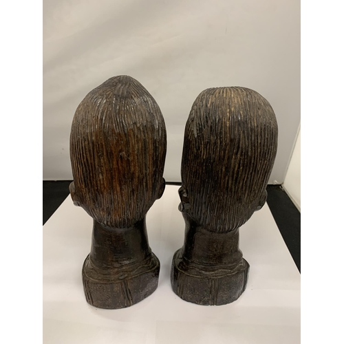 113 - A PAIR OF CARVED HARDWOOD AFRICAN STYLE BUSTS HEIGHT 25CM