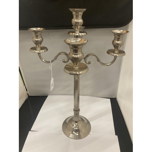 140 - A HEAVY WHITE METAL FIVE BRANCHED CANDLEABRA HEIGHT 52CM