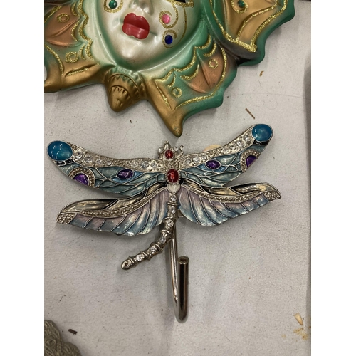 188 - A PORCELAIN BUTTERFLY LADY MASK, LEATHER LADY PLAQUE AND DRAGONFLY HOOK