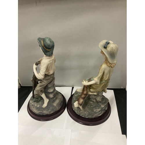 200 - TWO LARGE CONTINENTAL STYLE FIGURINES ON WOODEN BASES HEIGHT APPROX 32CM