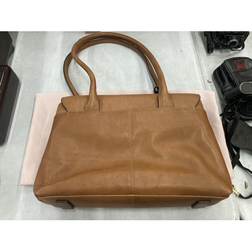 233 - A VINTAGE TAN COLOURED RADLEY BAG WITH COVER