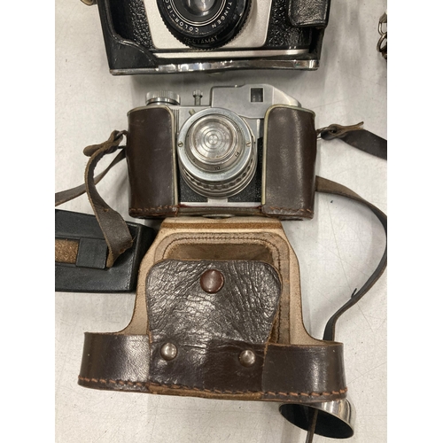 242 - THREE VINTAGE CAMERAS TO INCLUDE A ZENIT-E, BENCINI COMET 5 AND A ZORKI PACEMAKER, ALL IN ORIGINAL C... 