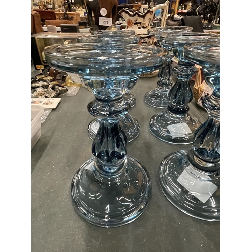 277 - SIX BLUE GLASS CANDLE HOLDERS