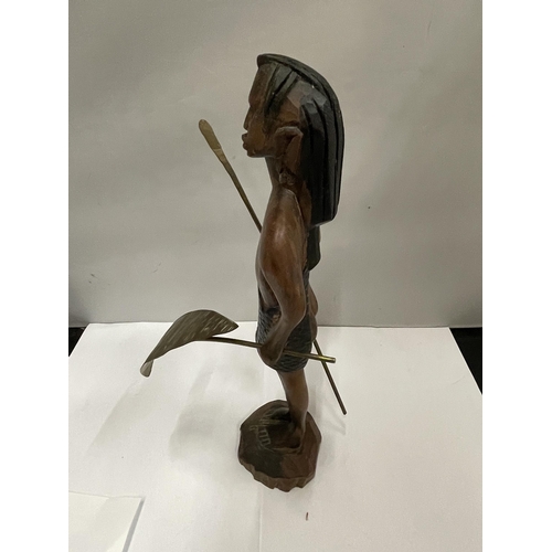 279 - A WOODEN CARVED FIGURE OF AN AFRICAN WARRIOR WITH SPEAR AND SHIELD HEIGHT 30CM