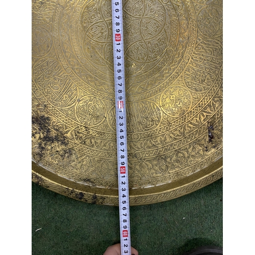 86 - A LARGE MIDDLE EASTERN BRASS CHARGER, DIAMETER 56CM
