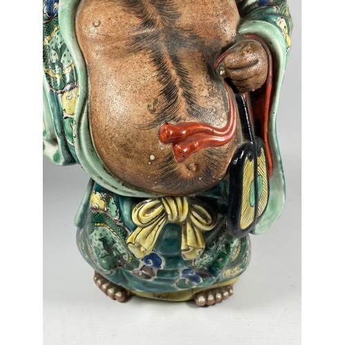 391 - A LARGE JAPANESE MEIJI PERIOD (1868-1912) POTTERY MODEL OF HOTEI WEARING CHINESE DRAGON DESIGN ROBE,... 