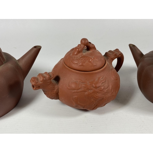 393 - A GROUP OF THREE CHINESE YIXING CLAY TEAPOTS, LARGEST 10.5CM