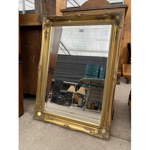 2699 - A MODERN OAK FRAMED WALL MIRROR 36