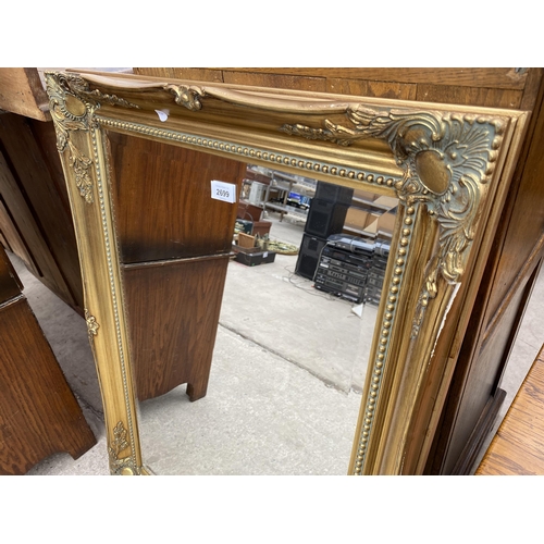 2699 - A MODERN OAK FRAMED WALL MIRROR 36