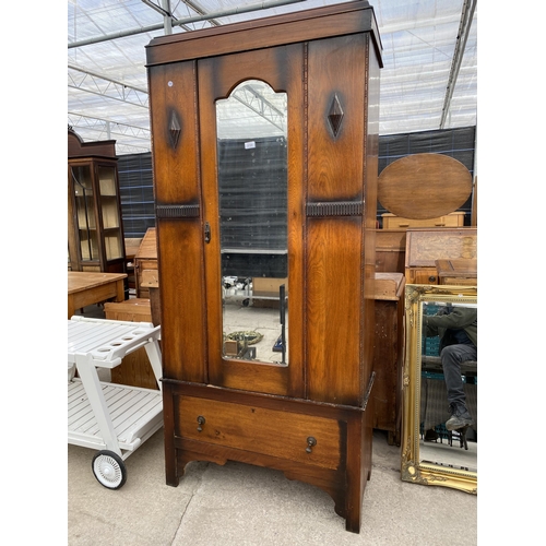 2700 - A MID 20TH CENTURY OAK MIRROR DOOR WARDROBE 35