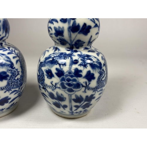 301A - A PAIR OF QING 19TH CENTURY CHINESE BLUE AND WHITE KANGXI STYLE DOUBLE GOURD VASES, FOUR CHARACTER M... 