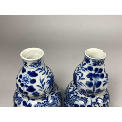 301A - A PAIR OF QING 19TH CENTURY CHINESE BLUE AND WHITE KANGXI STYLE DOUBLE GOURD VASES, FOUR CHARACTER M... 