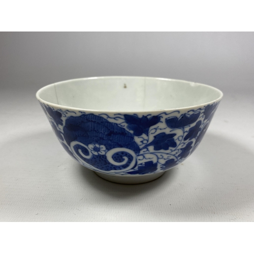 303A - A QING 19TH CENTURY CHINESE BLUE AND WHITE PORCELAIN BOWL WITH LOTUS DESIGN, FOUR CHARACTER MARK TO ... 