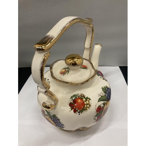 131 - A POTTERY LARGE 'GYPSY' STYLE KETTLE WITH FRUIT DECORATION WITH FOUR DOOR PLATES