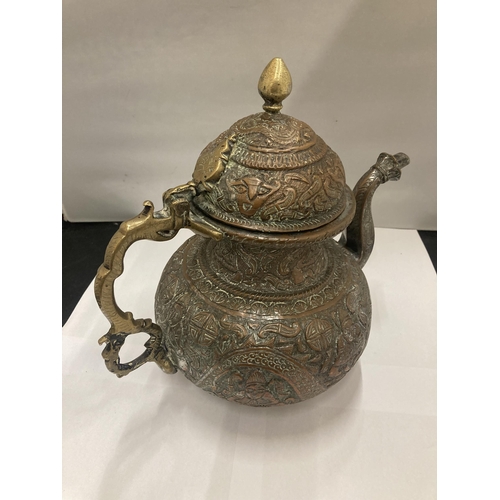 143 - AN ASIAN STYLE COPPER TEAPOT WITH EMBOSSED DESIGN