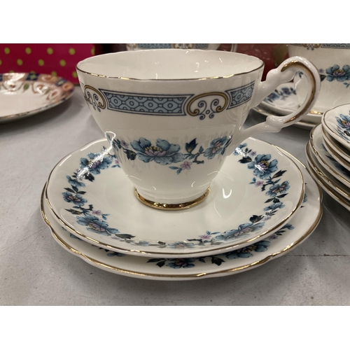 255 - A QUANTITY OF CHINA CUPS AND SAUCERS PLUS A SUGAR BOWL