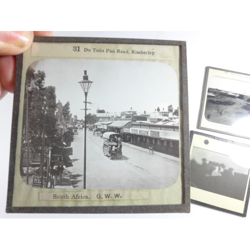 429 - TWO BOXES CONTAINING SIXTY-FOUR BLACK AND WHITE PHOTOGRAPHIC SLIDES RELATING TO THE BOER WAR