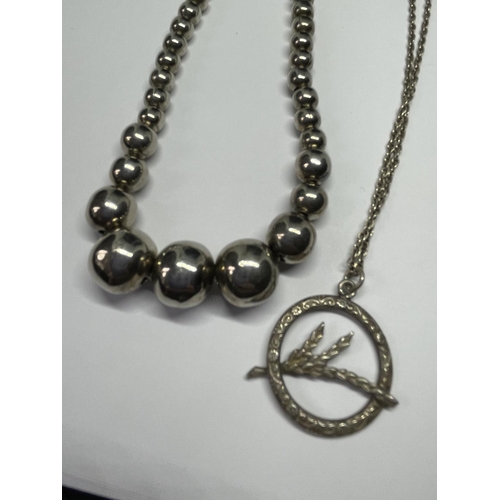 561 - FOUR SILVER NECKLACES ONE BALL DESIGN AND THREE WITH PENDANTS