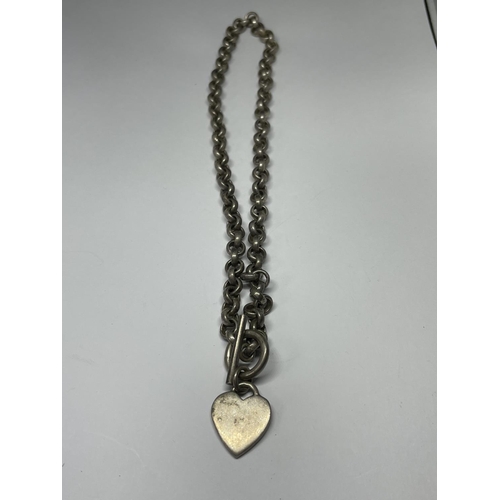 564 - A SILVER T BAR NECKLACE WITH HEART FOB