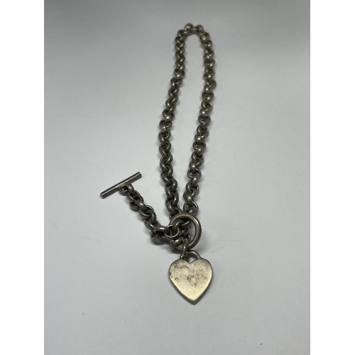 564 - A SILVER T BAR NECKLACE WITH HEART FOB