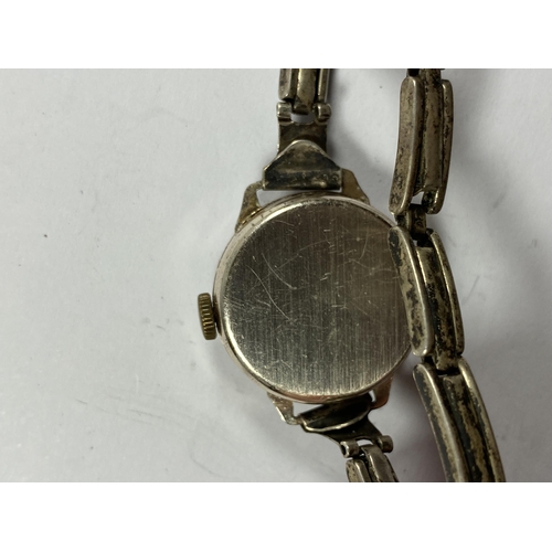 697 - A VINTAGE SILVER HORSHAM LADIES WATCH