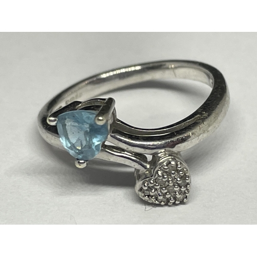 727 - A 9 CARAT GOLD RING WITH A HEART SHAPED AQUAMARINE AND DIAMONDS SIZE N