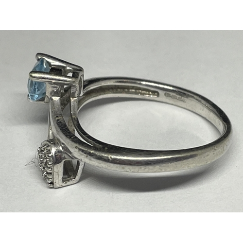 727 - A 9 CARAT GOLD RING WITH A HEART SHAPED AQUAMARINE AND DIAMONDS SIZE N